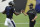 Baltimore Ravens quarterback Lamar Jackson, left, greets coach John Harbaugh during NFL football training camp Saturday, Aug. 29, 2020, in Baltimore. AP Photo/Gail Burton)