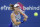 Alize Cornet, of France, returns to Sofia Kenin, of the United States, at the Western & Southern Open tennis tournament, Sunday, Aug. 23, 2020, in New York. (AP Photo/Frank Franklin II)