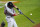 Boston Red Sox's J.D. Martinez swings at a pitch from the Baltimore Orioles during the ninth inning of a baseball game, Thursday, Aug. 20, 2020, in Baltimore. The Red Sox won 7-1. (AP Photo/Julio Cortez)