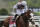 FILE - In this June 20, 2020, file photo, Tiz the Law (8), with jockey Manny Franco up, crosses the finish line to win the 152nd running of the Belmont Stakes horse race in Elmont, N.Y. The Belmont Stakes winner ]completed his final workout on Saturday, Aug. 29, 2020, with a week to go before he's expected to compete as the probable favorite in the Kentucky Derby.  (AP Photo/Seth Wenig, File)