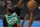 Toronto Raptors' Kyle Lowry (7) shoots in front of Boston Celtics' Jaylen Brown, left, in the first half of an NBA conference semifinal playoff basketball game Thursday, Sept 3, 2020, in Lake Buena Vista Fla. (AP Photo/Mark J. Terrill)