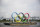 A symbol installed for the Olympic and Paralympic Games Tokyo 2020 on a barge is moved away from its usual spot by tugboats off the Odaiba Marine Park in Tokyo Thursday, Aug. 6, 2020. The five Olympic rings floating on a barge in Tokyo Bay were removed for what is being called “maintenance,” and officials says they will return to greet next year's Games. The Tokyo Olympics have been postponed for a year because of the coronavirus pandemic and are to open on July 23, 2021. The Paralympics follow on Aug. 24. (AP Photo/Hiro Komae)