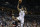 Milwaukee Bucks' Giannis Antetokounmpo (34) shoots over Portland Trail Blazers' Damian Lillard during the first half of an NBA basketball game Saturday, Oct. 21, 2017, in Milwaukee. (AP Photo/Tom Lynn)
