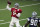 Dallas Cowboys quarterback Dak Prescott (4) passes against defender DeMarcus Lawrence (90) during an NFL football training camp practice in Frisco, Texas, Monday, Aug. 31, 2020. (AP Photo/LM Otero)