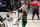 Miami Heat's Jimmy Butler, bottom left, and Jae Crowder (99) look on as Bam Adebayo (13) blocks a shot attempt by Boston Celtics' Jayson Tatum (0) in the closing seconds of overtime of an NBA conference final playoff basketball game, Tuesday, Sept. 15, 2020, in Lake Buena Vista, Fla. (AP Photo/Mark J. Terrill)