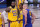 Los Angeles Lakers' LeBron James (23), Rajon Rondo (9) and Denver Nuggets' Nikola Jokic, wait for play to restart during the second half an NBA conference final playoff basketball game, Friday, Sept. 18, 2020, in Lake Buena Vista, Fla. (AP Photo/Mark J. Terrill)