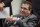 FILE - This Jan. 2, 2020, file photo shows Washington Redskins owner Dan Snyder listening to head coach Ron Rivera during a news conference at the team's NFL football training facility, in Ashburn, Va. Snyder has hired a D.C. law firm to review the Washington NFL team's culture, policies and allegations of workplace misconduct. Beth Wilkinson of Wilkinson Walsh LLP confirmed to The Associated Press that the firm had been retained to conduct an independent review. (AP Photo/Alex Brandon, File)