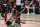 Miami Heat forward Jimmy Butler (22) leaps to the basket for a shot over Boston Celtics' Robert Williams III, bottom left, and Gordon Hayward, bottom center, during the first half of Game 4 of an NBA basketball Eastern Conference final, Wednesday, Sept. 23, 2020, in Lake Buena Vista, Fla. (AP Photo/Mark J. Terrill)