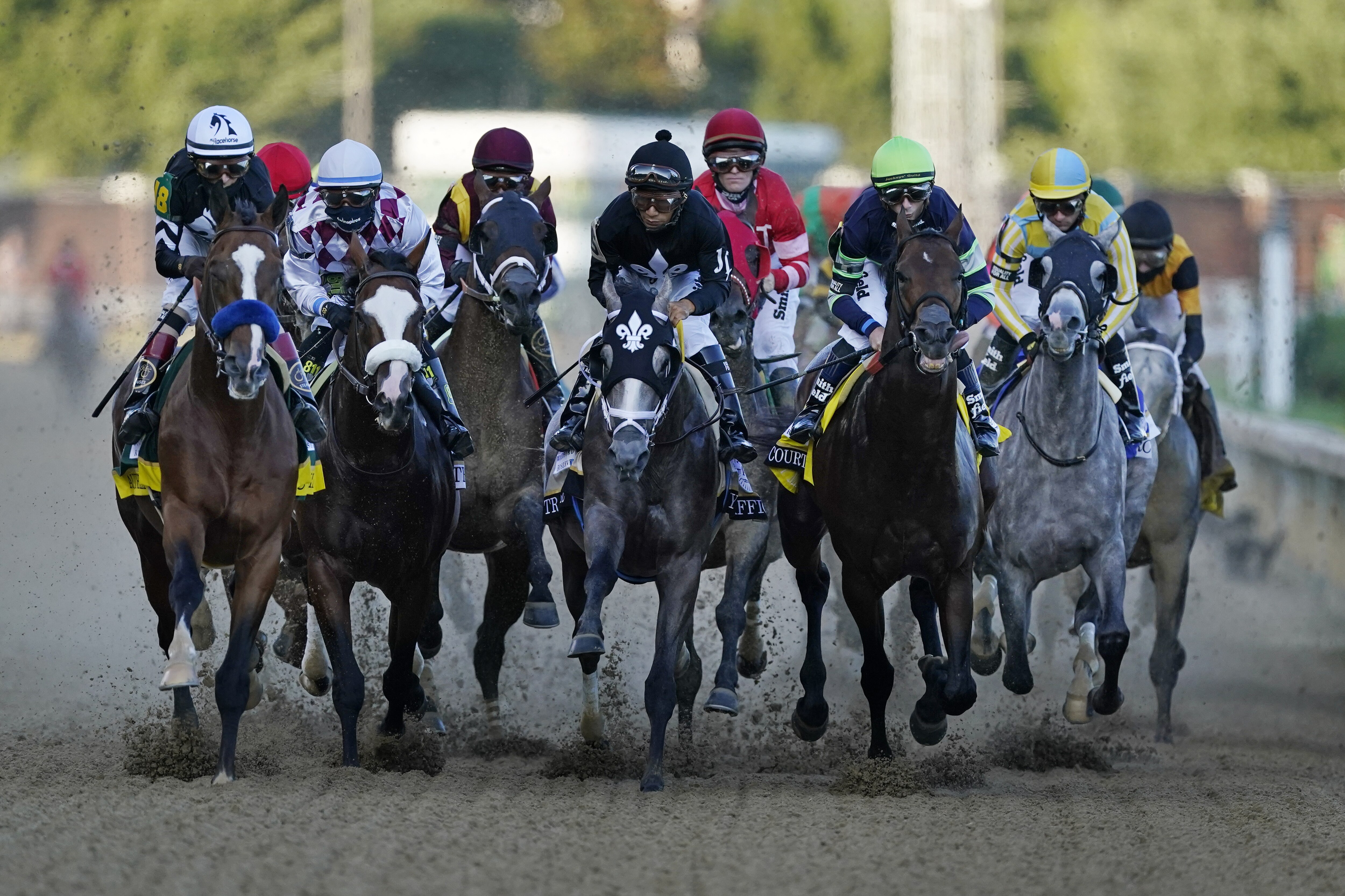 John Velazquez rides Authentic, left, as they head to turn one in the 146th running of the Kentucky Derby horse race at Churchill Downs, Saturday, Sept. 5, 2020, in Louisville, Ky. (AP Photo/Mark Humphrey)