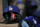 Los Angeles Dodgers hats are seen near gloves in the dugout during the eighth inning of a baseball game against the Baltimore Orioles, Tuesday, Sept. 10, 2019, in Baltimore. The Orioles won 7-3. (AP Photo/Julio Cortez)