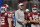 FILE - In this Saturday, Dec. 28, 2019, file photo, Oklahoma head coach Lincoln Riley speaks with his team before the first half of the Peach Bowl NCAA semifinal college football playoff game against LSU, in Atlanta. Riley already has coached Heisman Trophy winners Baker Mayfield and Kyler Murray along with Heisman runner-up Jalen Hurts. Now, he is hoping to build a new tradition at Oklahoma - pulling top quarterbacks to Oklahoma from the high school ranks. Caleb Williams, the No. 1 quarterback in the 247Sports Class of 2021 and ESPNâ€™s No. 1 dual-threat quarterback for that class, has committed to OKlahoma.(AP Photo/John Amis, File)
