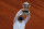 Poland's Iga Swiatek lifts the trophy after winning the final match of the French Open tennis tournament against Sofia Kenin of the U.S. in two sets 6-4, 6-1, at the Roland Garros stadium in Paris, France, Saturday, Oct. 10, 2020. (AP Photo/Alessandra Tarantino)