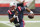 FILE - In this Sunday, Sept. 27, 2020, file photo, New England Patriots quarterback Cam Newton runs against the Las Vegas Raiders during an NFL football game at Gillette Stadium, in Foxborough, Mass. For the second straight week the New England Patriots are heading into a game after having their preparations disrupted by a teammate contracting coronavirus.  Last week it was Cam Newton, who tested positive two days before their matchup with Kansas City and was forced to sit out.(AP Photo/Winslow Townson, File)