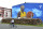 A boy rides a bicycle in front of a new tribute mural honoring former Los Angeles Lakers star Kobe Bryant who was killed in a helicopter crash on Jan. 26, on the school building in Bosanska Gradiska, Bosnia, Wednesday, June 3, 2020. (AP Photo/Radivoje Pavicic)