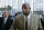 Former NFL football player Dana Stubblefield, front, leaves a federal courthouse with his attorney Mike Armstrong, left, in San Francisco, Friday, Jan. 18, 2008. Stubblefield pleaded guilty Friday to lying to investigators in the BALCO steroids case, making him the first football player charged in the long-running federal investigation. (AP Photo/Paul Sakuma)