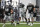 Las Vegas Raiders offensive tackle Trent Brown, center, warms up alongside offensive tackle Andre James (68) and guard Jordan Roos during an NFL football training camp practice Wednesday, Aug. 26, 2020, in Henderson, Nev. (Chase Stevens/Las Vegas Review-Journal via AP, Pool)