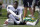 FILE - In this Wednesday, Sept. 18, 2019, file photo, New England Patriots wide receiver Antonio Brown puts on his  Nike cleats during NFL football practice in Foxborough, Mass. Nike has dropped Brown, Nike spokesman Josh Benedek told The Associated Press on Friday, Sept. 20, 2019. The move comes after a second woman accused Brown of sexual assault.   (AP Photo/Steven Senne, File)