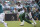Jacksonville Jaguars quarterback Gardner Minshew (15) scrambles away from New York Jets defensive tackle Quinnen Williams (95) during the second half of an NFL football game Sunday, Oct. 27, 2019, in Jacksonville, Fla. (AP Photo/Phelan M. Ebenhack)