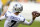 Dallas Cowboys quarterback Ben DiNucci (7) dons a helmet saying