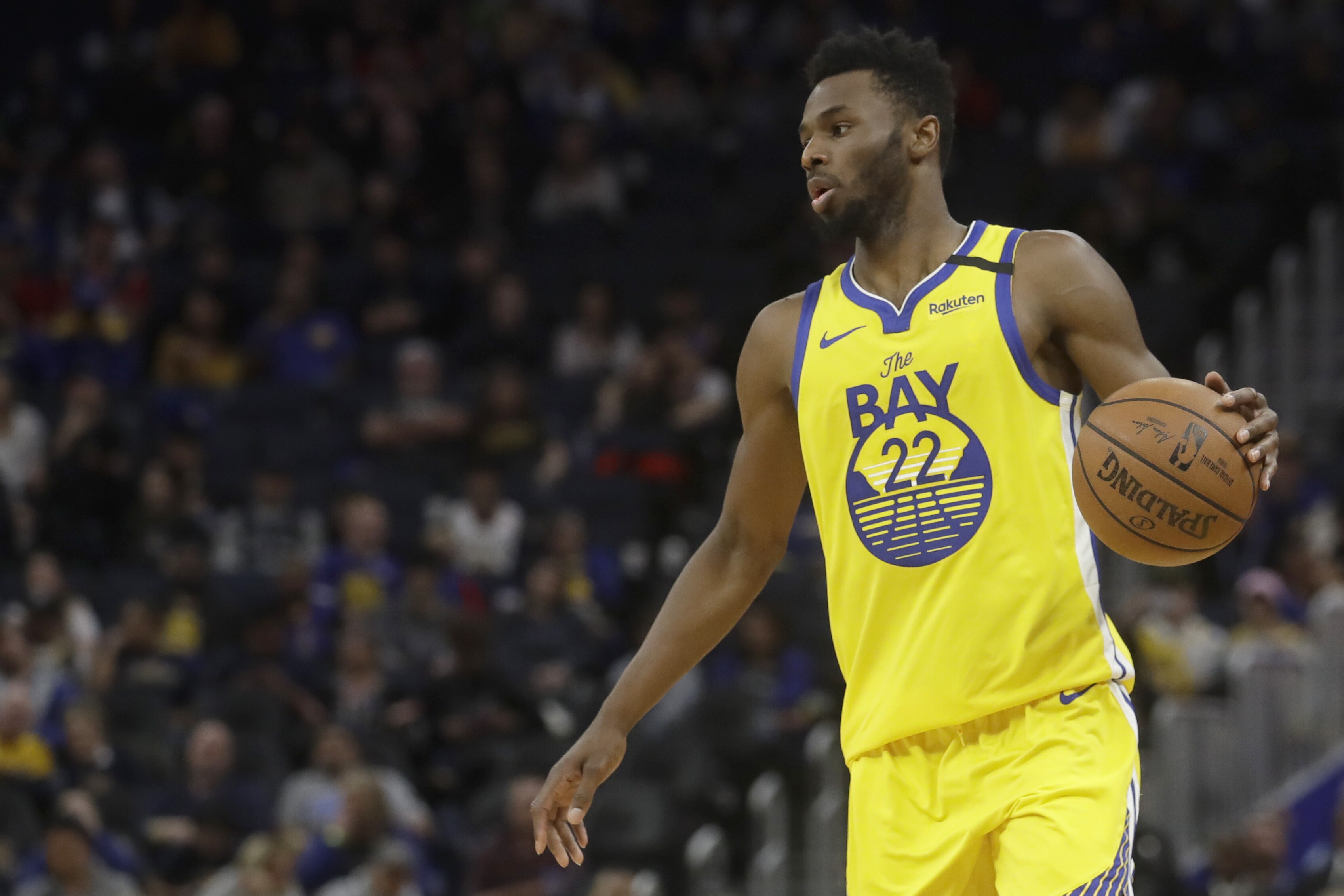 Golden State Warriors guard Andrew Wiggins (22) against the Washington Wizards during an NBA basketball game in San Francisco, Sunday, March 1, 2020. (AP Photo/Jeff Chiu)