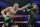 FILE - In this Feb. 22, 2020, file photo, Tyson Fury, left, of England, fights Deontay Wilder during a WBC heavyweight championship boxing match in Las Vegas. Fury is turning his attention to an all-British heavyweight unification bout with Anthony Joshua early next year after ending plans for a third fight with Deontay Wilder. Fury claimed the WBC belt from Wilder with a seventh-round stoppage in their rematch in Las Vegas in February and the British boxerâ€™s U.S. promoter, Bob Arum, was looking to stage a third fight between them in front of 15,000 spectators at the home of NFL team Las Vegas Raiders on Dec. 19. (AP Photo/Isaac Brekken, File)