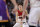 LaMelo Ball of the Illawarra Hawks looks for an opening during their game against the Sydney Kings in the Australian Basketball League in Sydney, Sunday, Nov. 17, 2019. (AP Photo/Rick Rycroft)