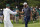 Dustin Johnson is congratulated by his caddie Austin Johnson after winning the Masters golf tournament Sunday, Nov. 15, 2020, in Augusta, Ga. (AP Photo/David J. Phillip)