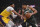 Milwaukee Bucks forward Giannis Antetokounmpo, right, drives to the basket as Los Angeles Lakers forward Anthony Davis defends during the first half of an NBA basketball game Friday, March 6, 2020, in Los Angeles. (AP Photo/Mark J. Terrill)