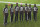 NFL officials, from left, umpire Barry Anderson, side judge Anthony Jeffries, down judge Julian Mapp, referee Jerome Boger, back judge Greg Steed, field judge Dale Shaw (104), line judge Carl Johnson (101) pose for a photo before an NFL football game between the Tampa Bay Buccaneers and the Los Angeles Rams Monday, Nov. 23, 2020, in Tampa, Fla. The game is the first in NFL history to feature an all African-American officiating crew. (AP Photo/Jason Behnken)