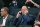 Former player agent and new New York Knicks president Leon Rose, center, takes a phone call during the first quarter of an NBA basketball game against the Houston Rockets in New York, Monday, March 2, 2020. (AP Photo/Kathy Willens)