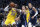 Los Angeles Lakers forward LeBron James (23) drives to the basket as Dallas Mavericks' Luka Doncic (77) and Kristaps Porzingis (6) defend during the first half of an NBA basketball game in Dallas, Friday, Nov. 1, 2019. (AP Photo/Tony Gutierrez)