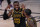 Los Angeles Lakers forward LeBron James talks with guard Kentavious Caldwell-Pope during the first half in Game 5 of basketball's NBA Finals against the Miami Heat Friday, Oct. 9, 2020, in Lake Buena Vista, Fla. (AP Photo/Mark J. Terrill)