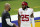 San Francisco 49ers cornerback Richard Sherman, right, talks to a coach before an NFL football game against the Los Angeles Rams Sunday, Nov. 29, 2020, in Inglewood, Calif. (AP Photo/Alex Gallardo)