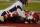 Kansas City Chiefs wide receiver Tyreek Hill (10) tries to catch a pass as Denver Broncos cornerback A.J. Bouye (21) defends in the first half of an NFL football game in Kansas City, Mo., Sunday, Dec. 6, 2020. The pass was called incomplete but replays showed the ball never hit the ground. (AP Photo/Charlie Riedel)