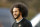 FILE - In this Nov. 16, 2019, file photo, free agent quarterback Colin Kaepernick arrives for a workout for NFL football scouts and media in Riverdale, Ga. The U.S. Navy is investigating a video in which military work dogs attacked a