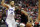 Houston Rockets' James Harden (13) drives toward the basket as Philadelphia 76ers' Ben Simmons (25) defends during the second half of an NBA basketball game Friday, March 8, 2019, in Houston. (AP Photo/David J. Phillip)