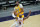 Los Angeles Lakers forward Anthony Davis (3) is fouled by Phoenix Suns guard Jevon Carter (4) during the first half of a preseason basketball game, Friday, Dec. 18, 2020, in Phoenix, Ariz. (AP Photo/Matt York)