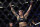 Amanda Nunes celebrates after defeating Germaine de Randamie in a mixed martial arts women's bantamweight championship bout at UFC 245, Saturday, Dec. 14, 2019, in Las Vegas. (AP Photo/John Locher)