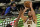 Cleveland Cavaliers' Kevin Love (0) shoots over Indiana Pacers' Myles Turner (33) in the first half of an NBA preseason basketball game, Saturday, Dec. 12, 2020, in Cleveland. (AP Photo/Tony Dejak)