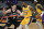 Los Angeles Lakers' LeBron James (23) drives against San Antonio Spurs' Drew Eubanks during the first half of an NBA basketball game Friday, Jan. 1, 2021, in San Antonio. (AP Photo/Darren Abate)