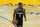 Sacramento Kings guard De'Aaron Fox (5) dribbles against the Golden State Warriors during the first half of an NBA basketball game in San Francisco, Monday, Jan. 4, 2021. (AP Photo/Jeff Chiu)