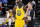 Golden State Warriors forward Draymond Green, left, argues for a call with referee Ed Malloy during the second half of the team's NBA basketball game against the Denver Nuggets on Thursday, Jan. 14, 2021, in Denver. The Nuggets won 114-104. (AP Photo/David Zalubowski)