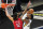 New Orleans Pelicans center Steven Adams (12) defends against Utah Jazz guard Donovan Mitchell during the first half of an NBA basketball game Thursday, Jan. 21, 2021, in Salt Lake City. (AP Photo/Rick Bowmer)