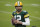 Green Bay Packers quarterback Aaron Rodgers warms up before an NFL divisional playoff football game between the Los Angeles Rams and Green Bay Packers, Saturday, Jan. 16, 2021, in Green Bay, Wis. (AP Photo/Mike Roemer)