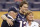New England Patriots quarterback Tom Brady (12) poses for a photo with his parents, Tom and Galynn Brady, in Lucas Oil Stadium on Saturday, Feb. 4, 2012, in Indianapolis. The Patriots are scheduled to face the New York Giants in NFL football Super Bowl XLVI on Feb. 5. (AP Photo/Mark Humphrey)