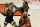 Iowa guard Joe Wieskamp (10) looks to pass as Illinois guard Ayo Dosunmu and center Kofi Cockburn defend in the first half of an NCAA college basketball game Friday, Jan. 29, 2021, in Champaign, Ill. (AP Photo/Holly Hart)