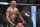 Kamaru Usman stands up after defeating Colby Covington in a mixed martial arts welterweight championship bout at UFC 245, Saturday, Dec. 14, 2019, in Las Vegas. (AP Photo/John Locher)
