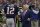 New England Patriots owner Robert Kraft, right, talks with quarterback Tom Brady (12) before an NFL football game against the Dallas Cowboys, Sunday, Oct. 11, 2015, in Arlington, Texas. (AP Photo/Tim Sharp)