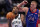 Brooklyn Nets guard Kyrie Irving (11) attempt a layup as Detroit Pistons center Mason Plumlee (24) defends during the first half of an NBA basketball game, Tuesday, Feb. 9, 2021, in Detroit. (AP Photo/Carlos Osorio)