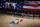 Players take a knee during the national anthem before Game 4 of an NBA basketball first-round playoff series between the Los Angeles Clippers and the Dallas Mavericks, Sunday, Aug. 23, 2020, in Lake Buena Vista, Fla. (Kevin C. Cox/Pool Photo via AP)